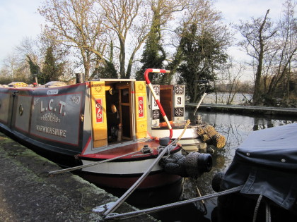 Image of boats covered in frost.